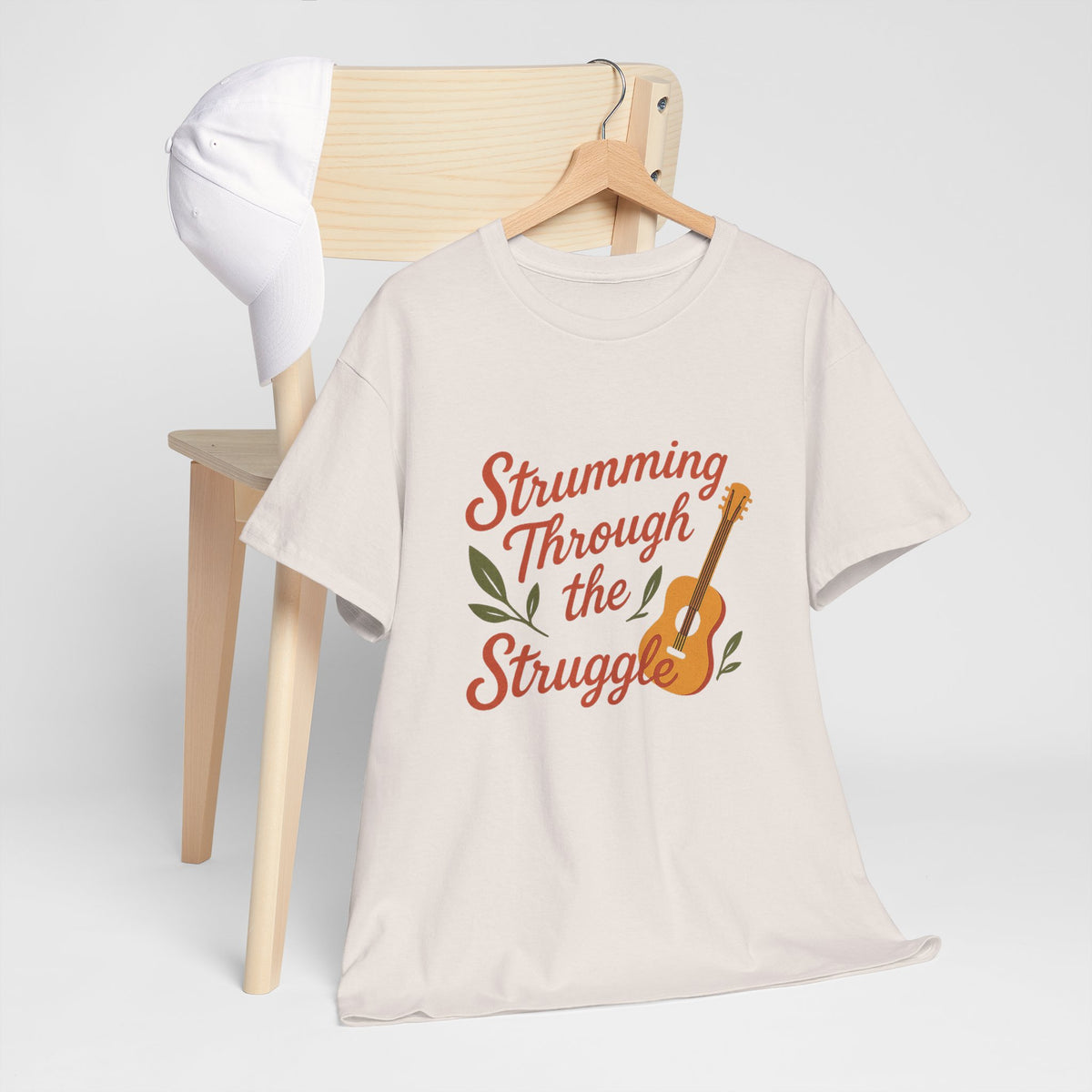 Strumming Through the Struggle, Comfortable, Unisex, Cotton Tee - Music Lover Shirt