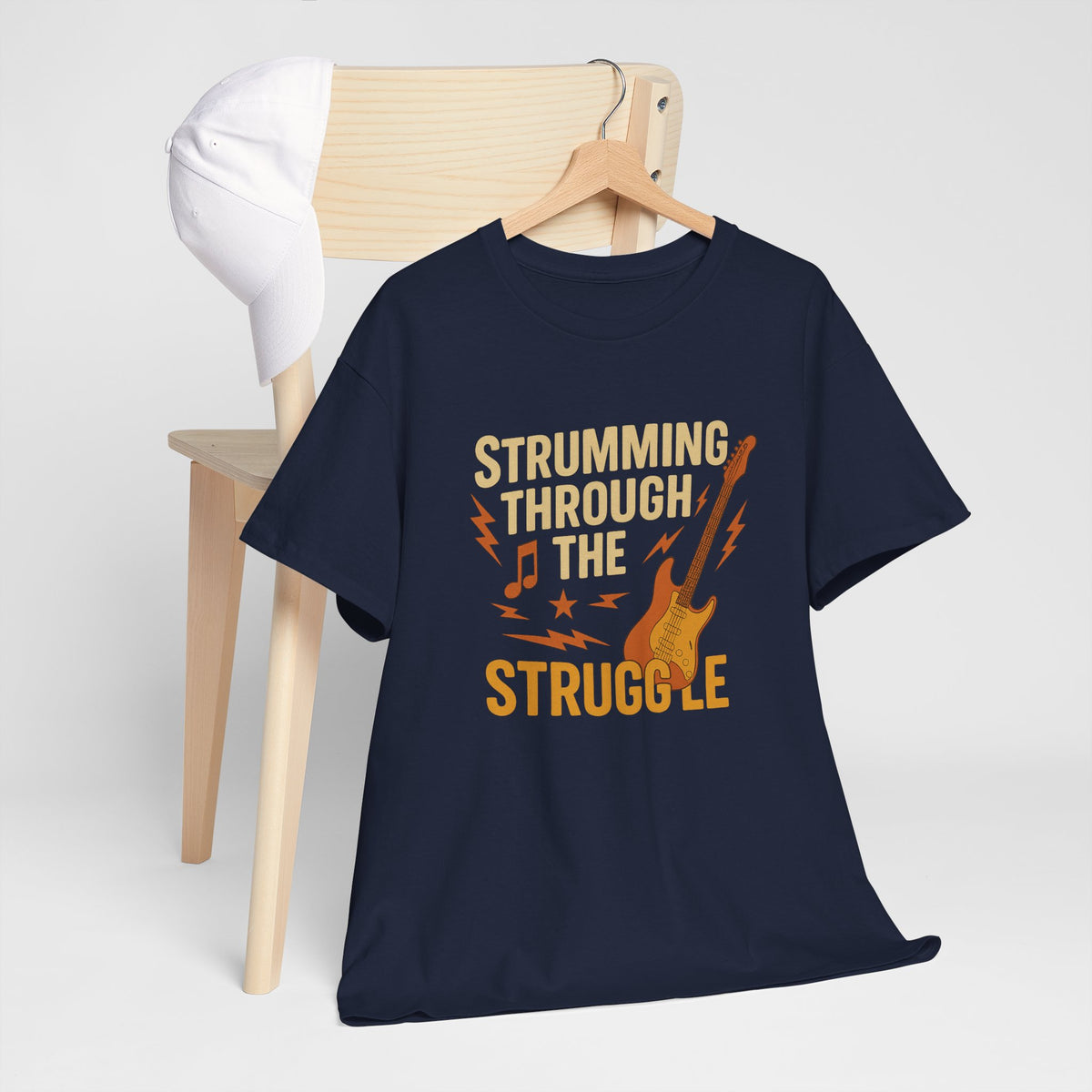 Strumming Through the Struggle, Comfortable, Unisex, Cotton Tee - Rock Music Lover's Motivational T-Shirt