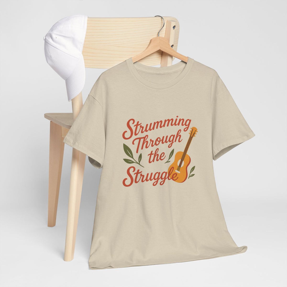 Strumming Through the Struggle, Comfortable, Unisex, Cotton Tee - Music Lover Shirt