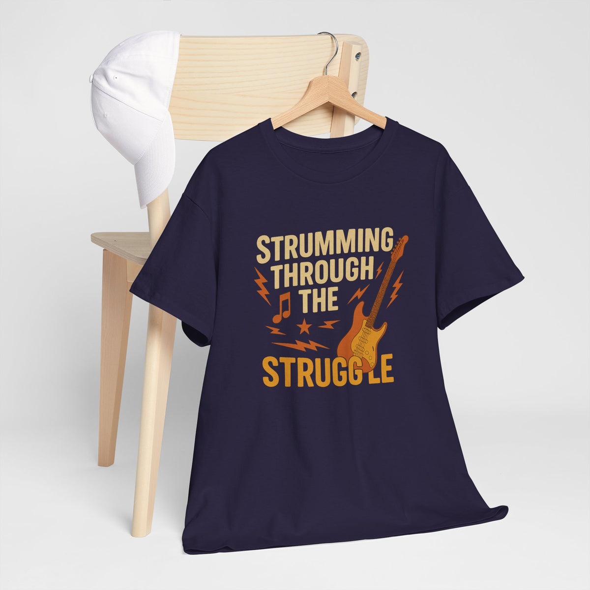 Strumming Through the Struggle, Comfortable, Unisex, Cotton Tee - Rock Music Lover's Motivational T-Shirt