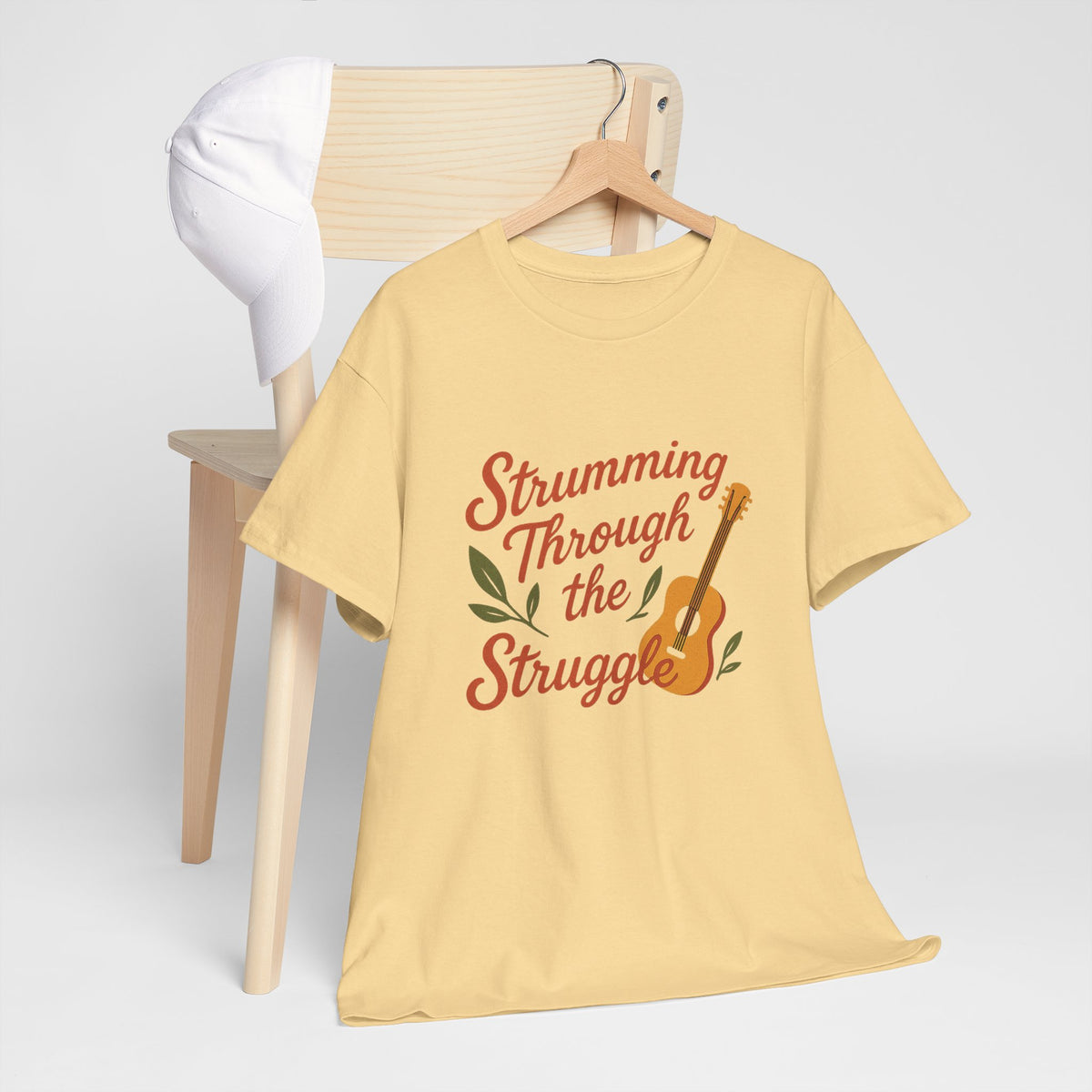 Strumming Through the Struggle, Comfortable, Unisex, Cotton Tee - Music Lover Shirt