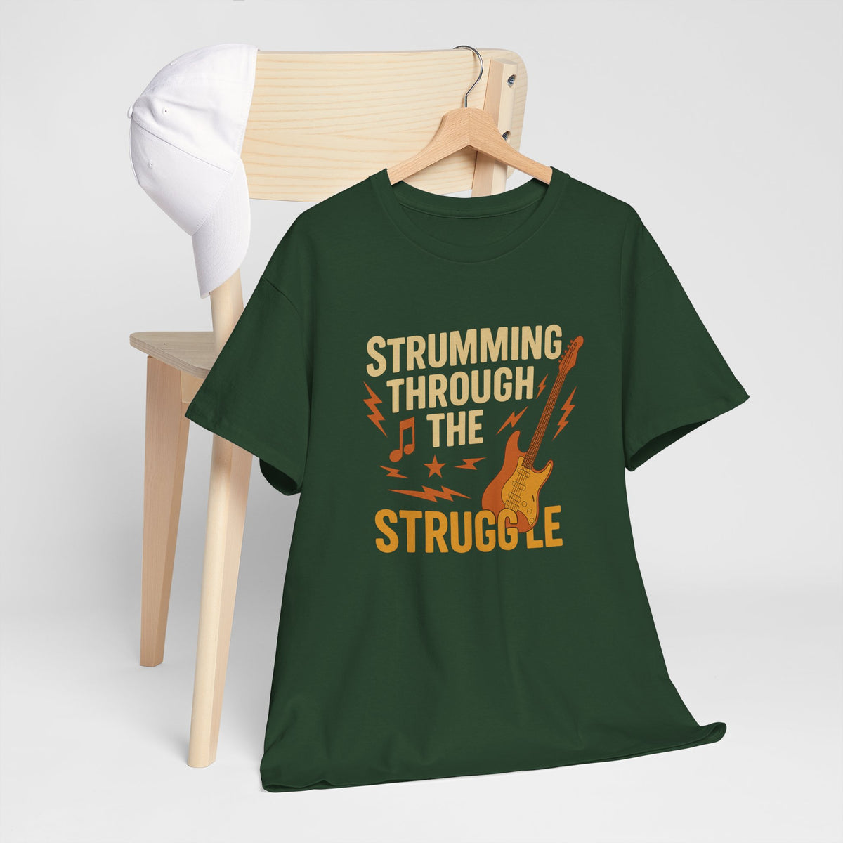 Strumming Through the Struggle, Comfortable, Unisex, Cotton Tee - Rock Music Lover's Motivational T-Shirt