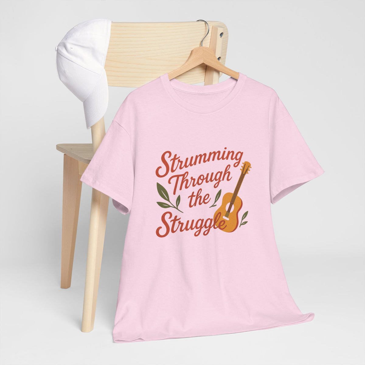 Strumming Through the Struggle, Comfortable, Unisex, Cotton Tee - Music Lover Shirt