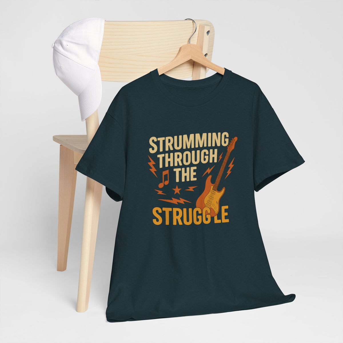 Strumming Through the Struggle, Comfortable, Unisex, Cotton Tee - Rock Music Lover's Motivational T-Shirt