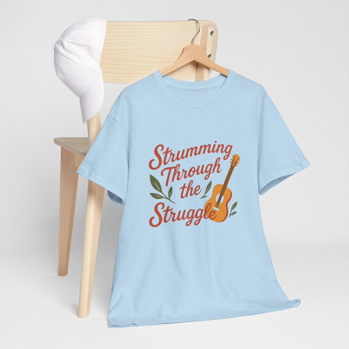 Strumming Through the Struggle, Comfortable, Unisex, Cotton Tee - Music Lover Shirt